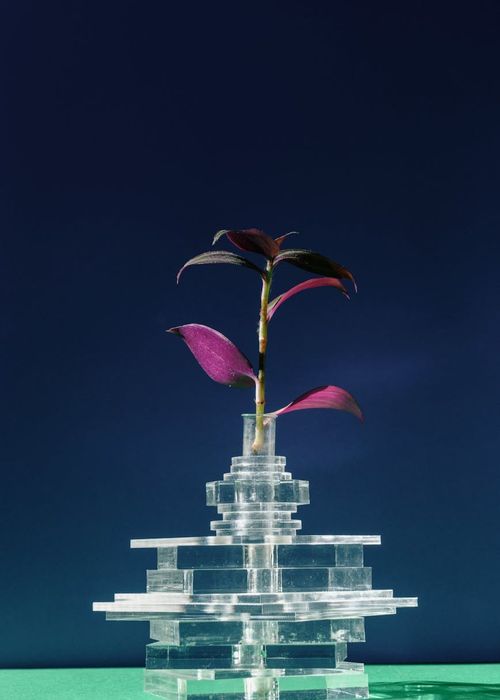 Vertical abstract composition of lime lines on dark background